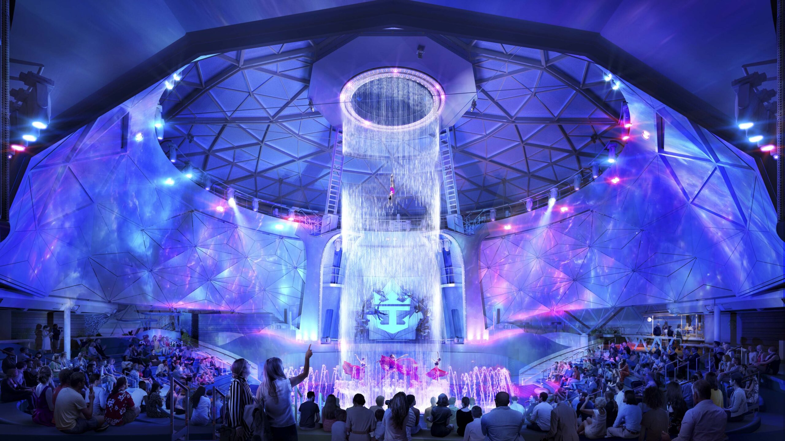 Dancers twirl beneath a circle of falling water as one person dives from the domed ceiling.