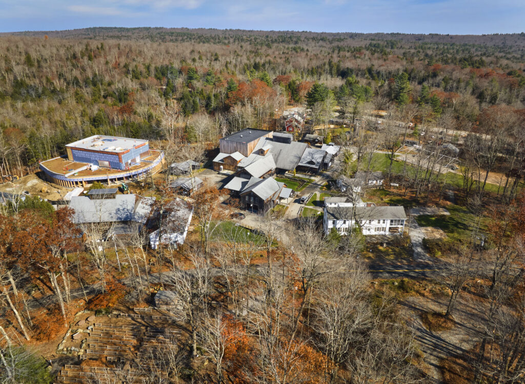 An aerial view of the construction site in winter shows the campus.