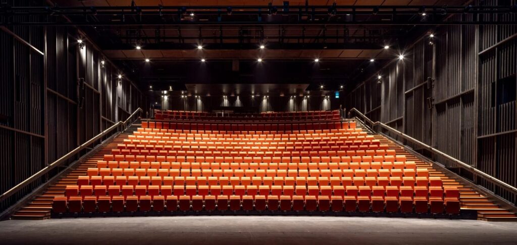 Orange seating rake at Sadler's Wells East.