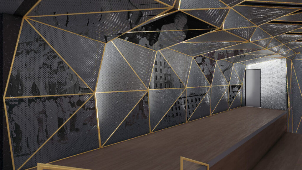 An elevated stage area surrounded by silver panels printed with photography.