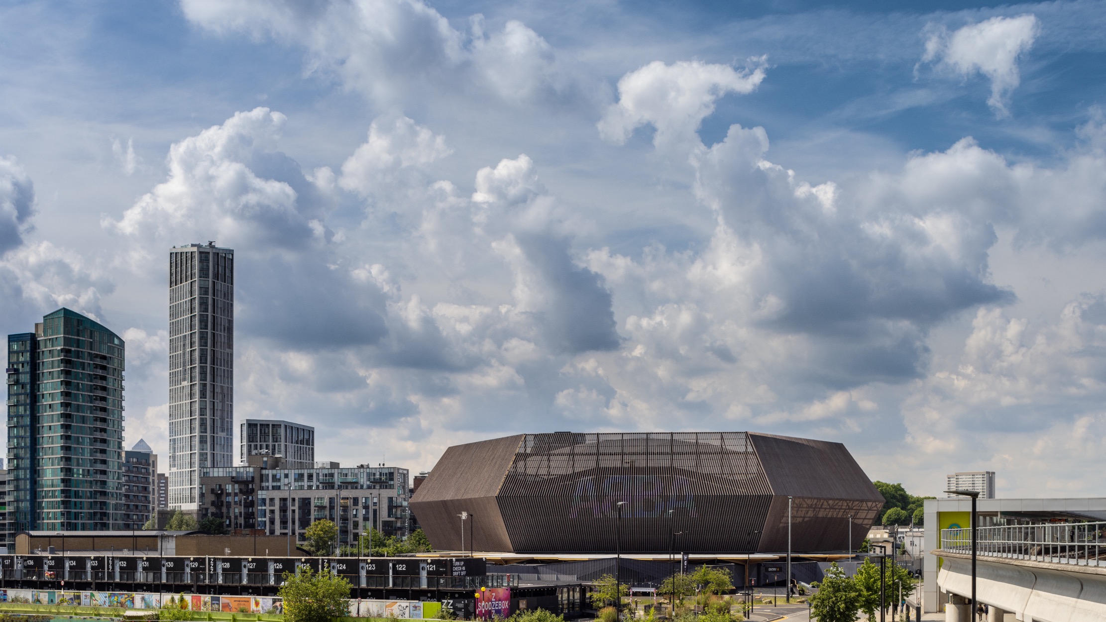 The angular arena structure seen among surrounding buildings. © Dirk Lindner courtesy of Stufish