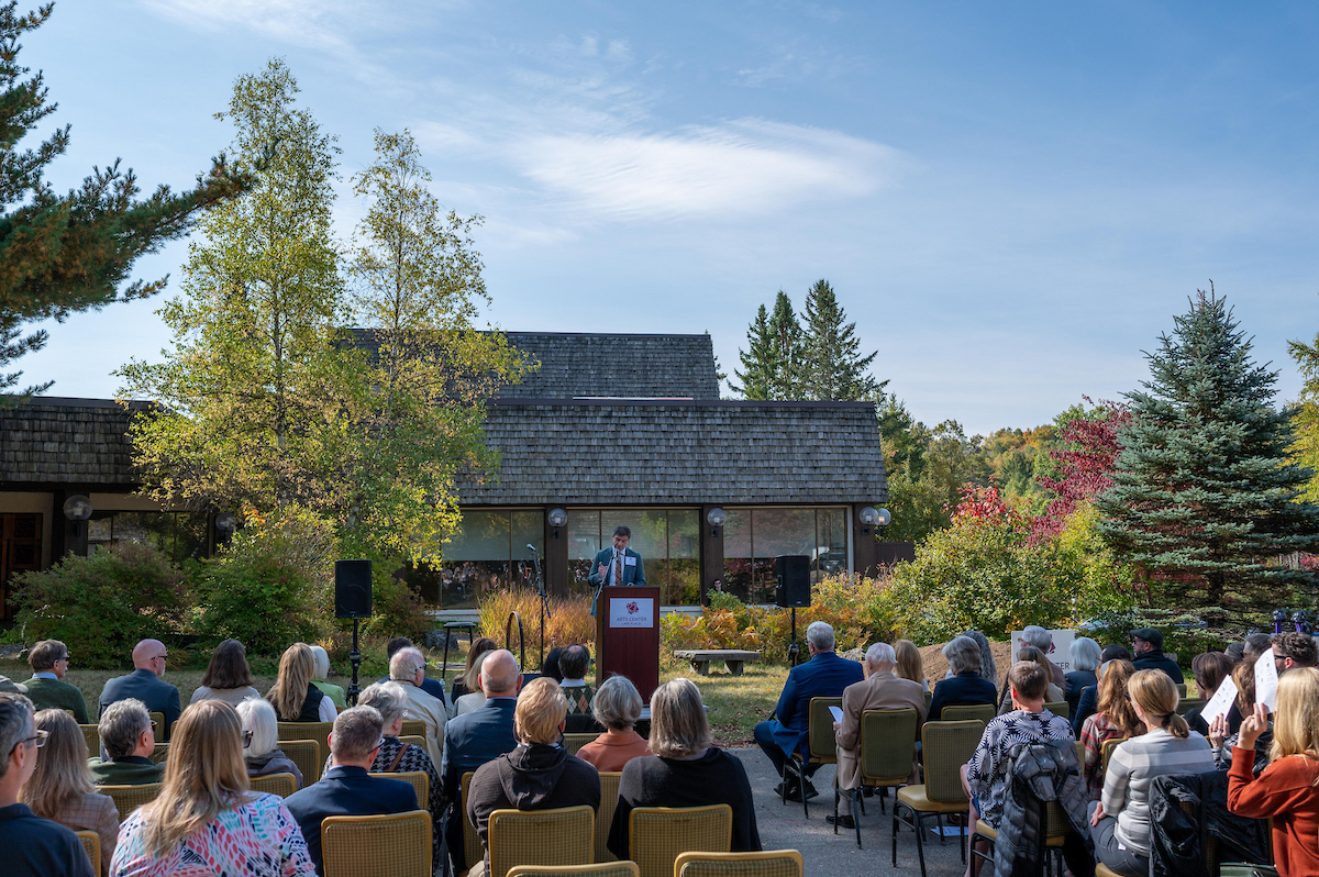 James Lemons speaks to audience outside the current Arts Center.