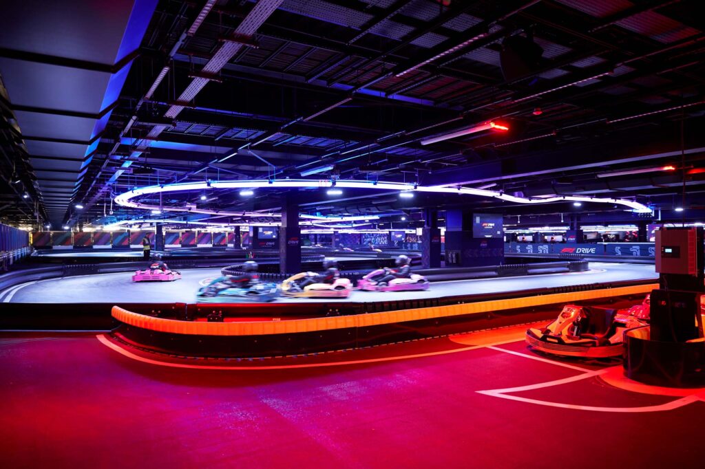 Colorfully illuminated interior go kart track. Photo by Pete Muller.