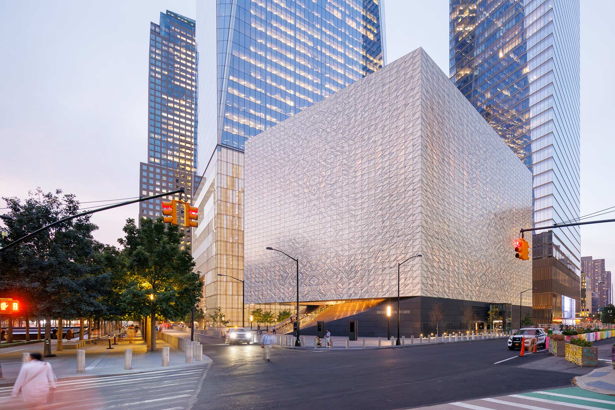 The PAC exterior gleaming under dusk lighting.
