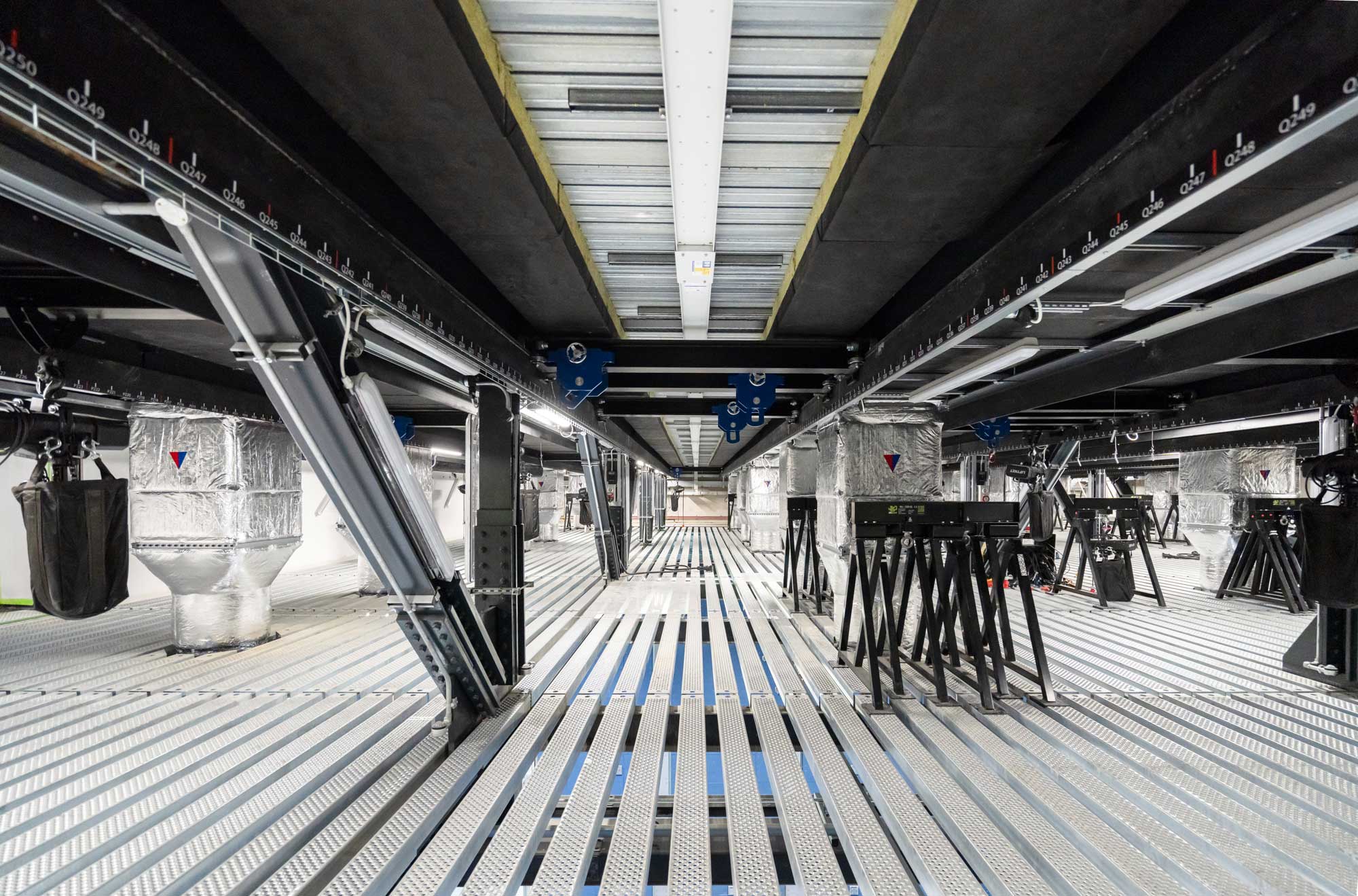 View of equipment in back of house catwalk or crawlspace. Photo by Marco Cappelletti. Courtesy of OMA and Factory International.
