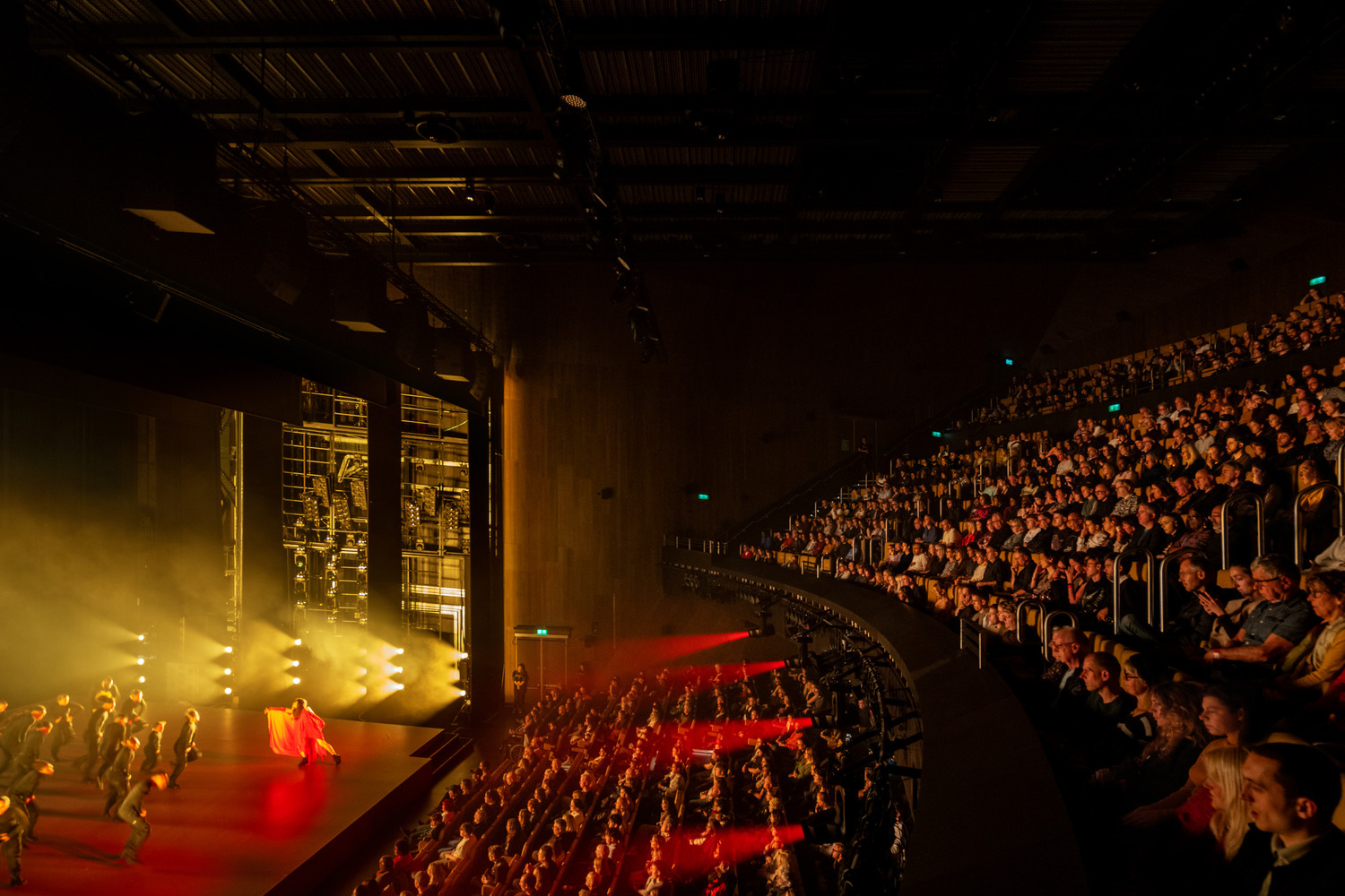 A packed audience views a dance performance at Aviva Studios, Manchester. Photo by Marco Cappelletti. Courtesy of OMA and Factory International.
