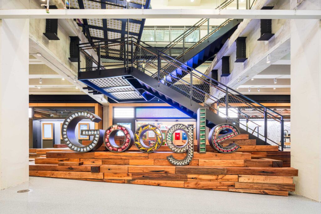 A dimensional Google sign with letters filled with New York City symbols.