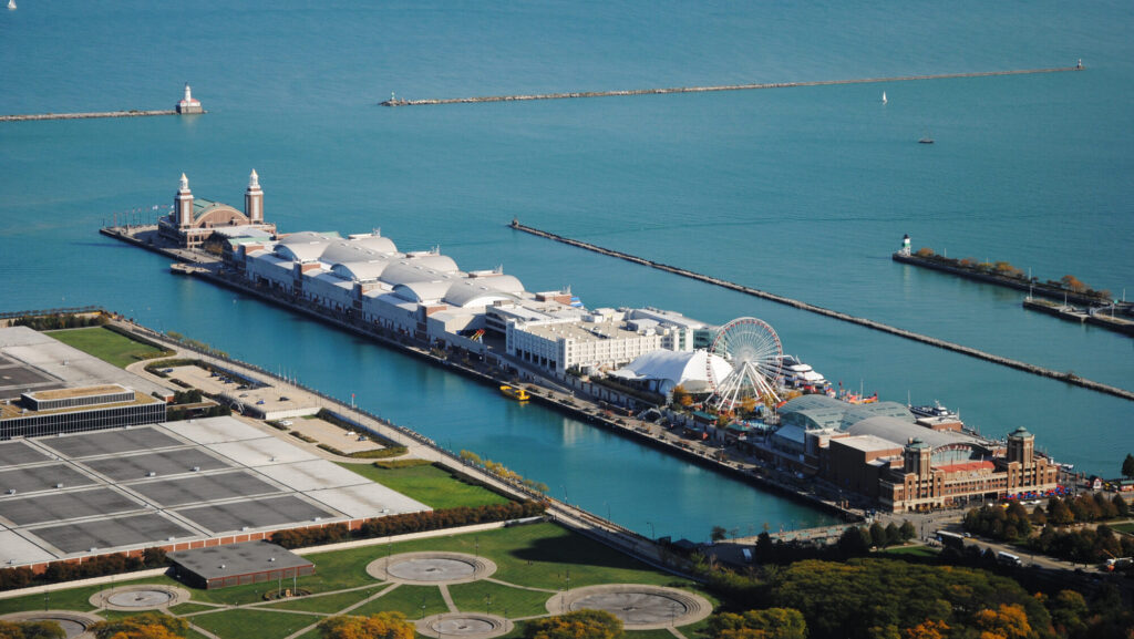 An aerial view of the pier with ferris wheel and many buildings.