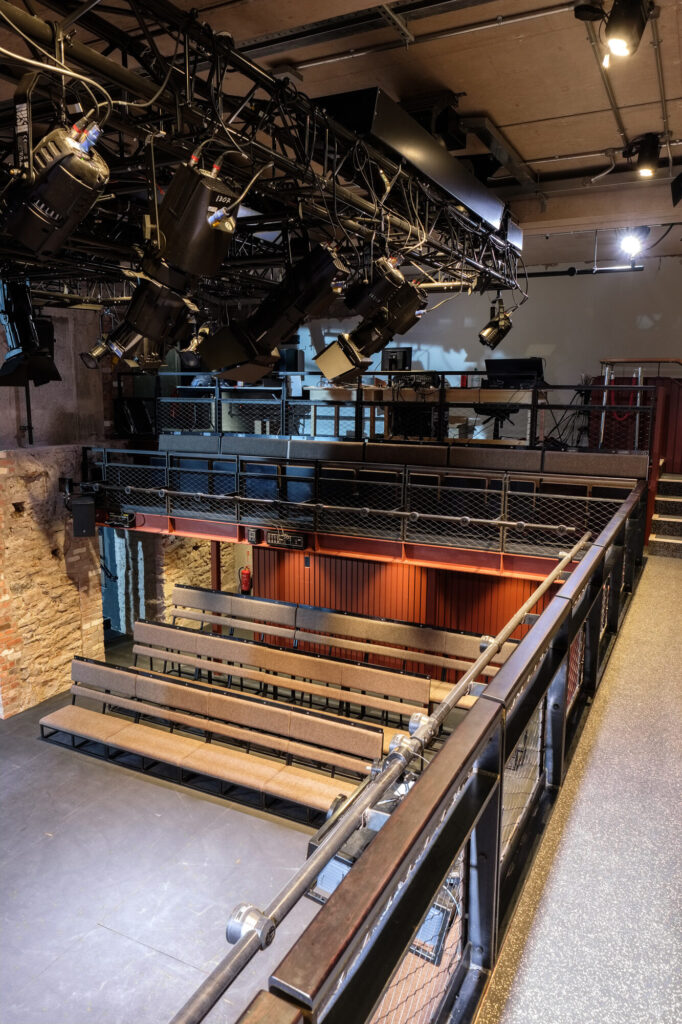 Balcony view looking down toward bench seating.