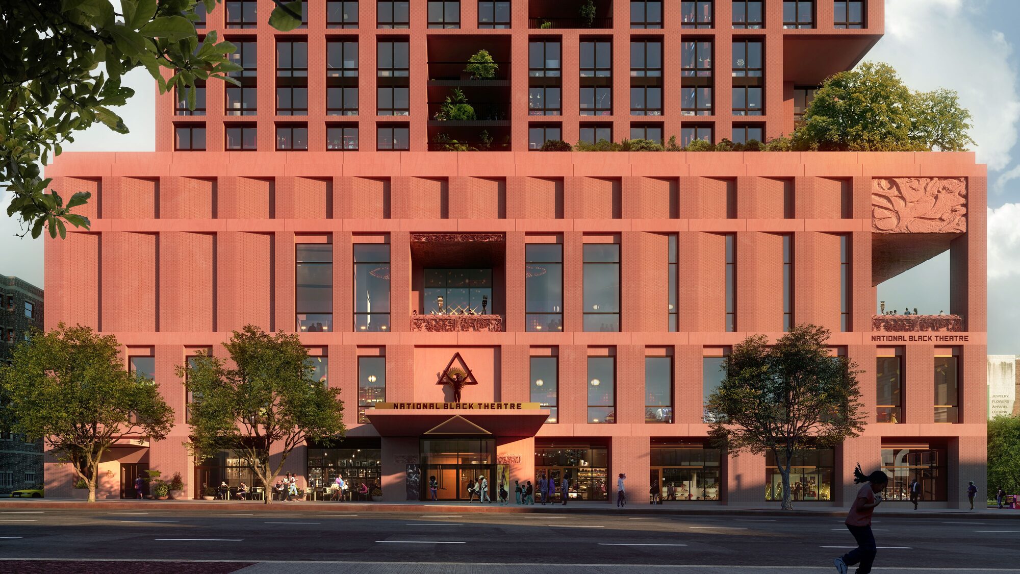 Modern building in brick color. A marquee hangs over the street with National Black Theatre sculpture.