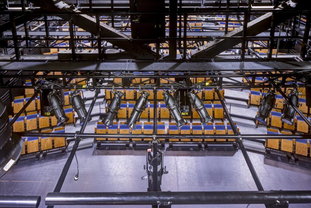 View from catwalk of lighting equipment and seating.