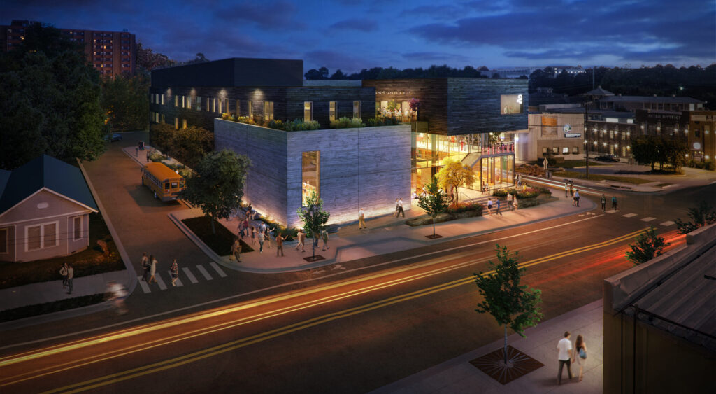 Exterior view of the boxy building at night.