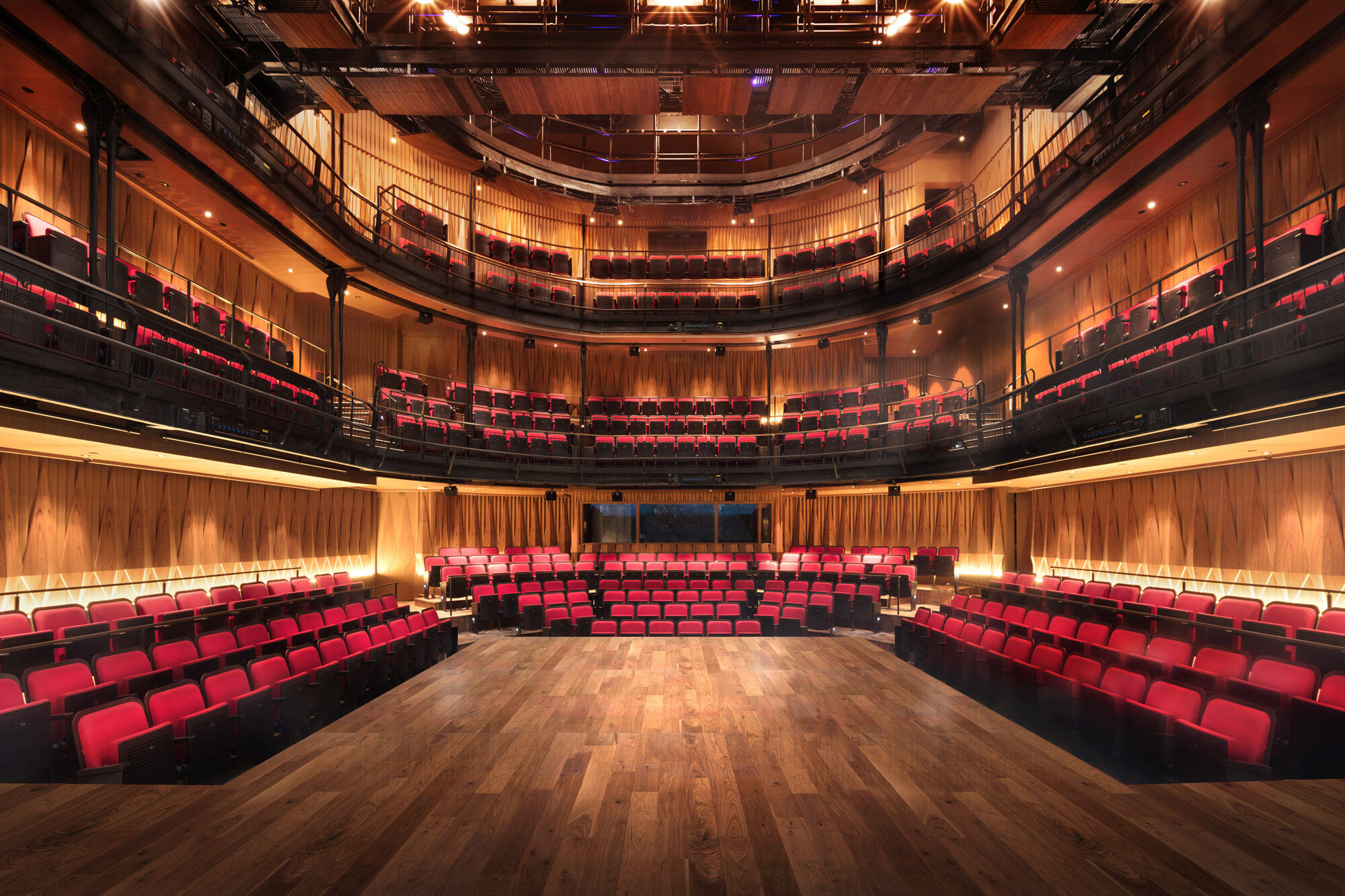 View of three levels of seating from the stage at W!ld Rice